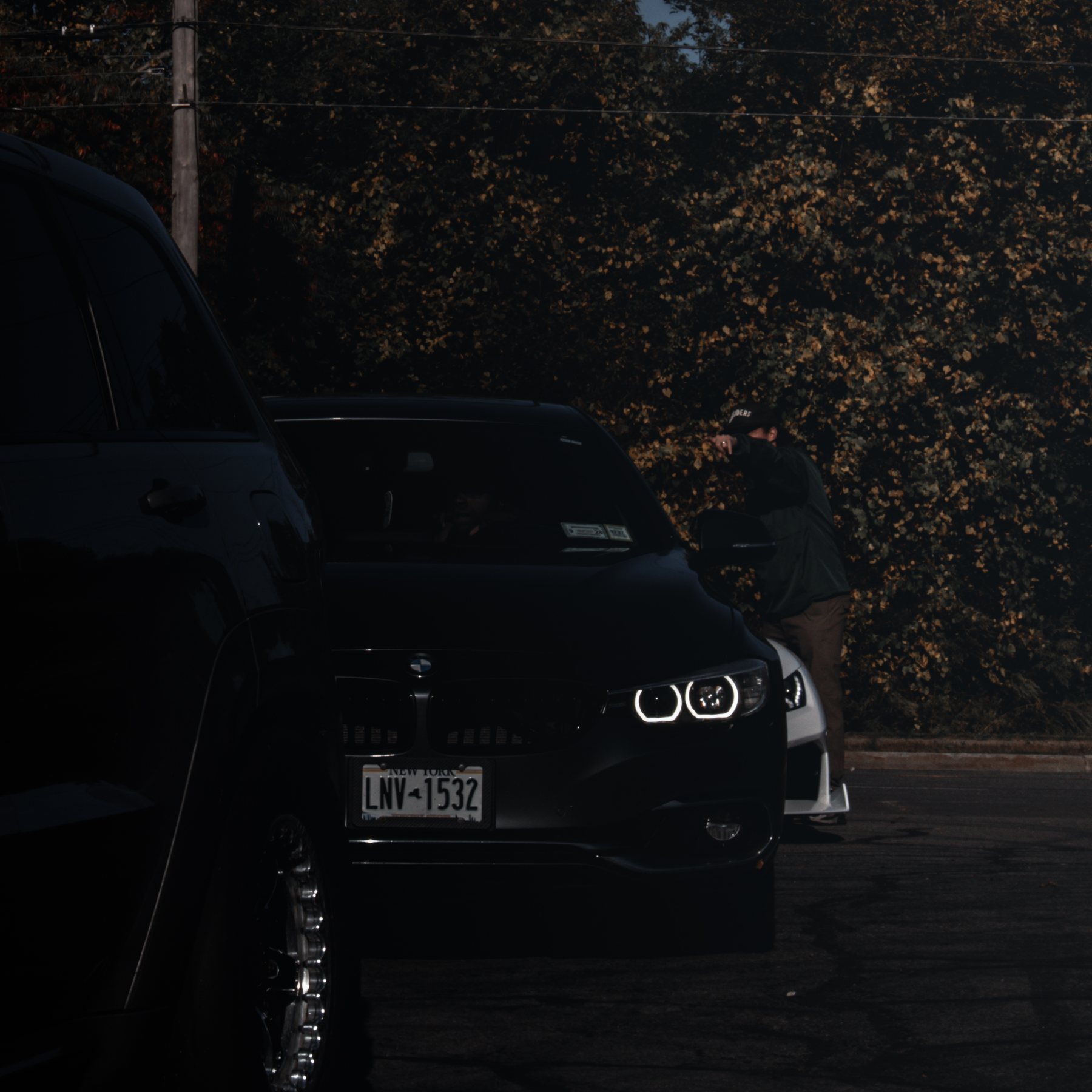Black BMW with angel eyes